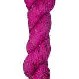 Skein of hand dyed BFL Tweed yarn in a neon pink color
