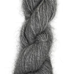 A handspun skein of angora and merino yarn in a natural grey color