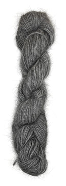A handspun skein of angora and merino yarn in a natural grey color