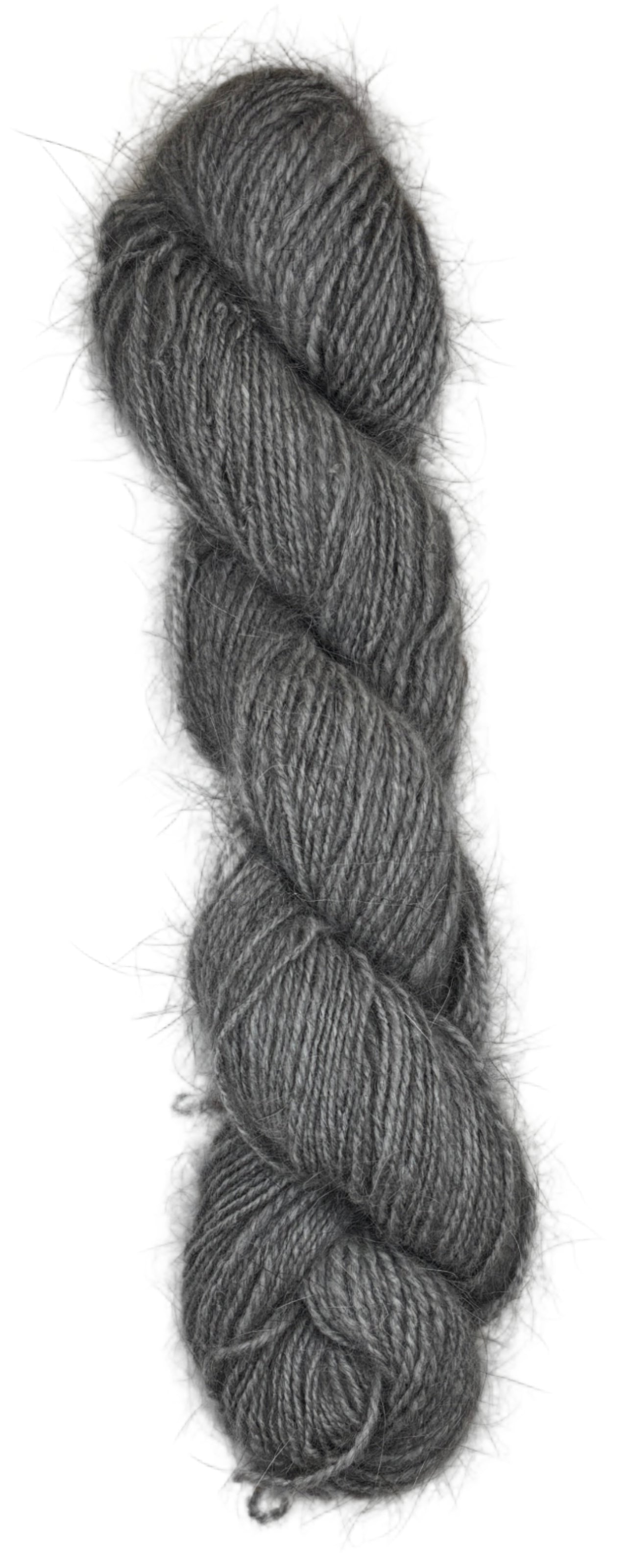 A skein of handspun angora and merino yarn in  natural grey color