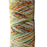 Green, red, yellow, orange speckled skein of yarn