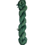 Green skein of wool yarn on a white background