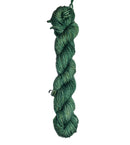 Green skein of wool yarn on a white background