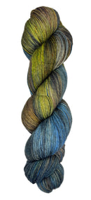 Skein of hand dyed yarn in the colors yellow black blue white brown 