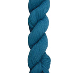 Blue skein of mountain meadow wool yarn on a white background