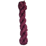 Burgundy skein of wool yarn on a white background
