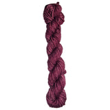 Burgundy skein of wool yarn on a white background