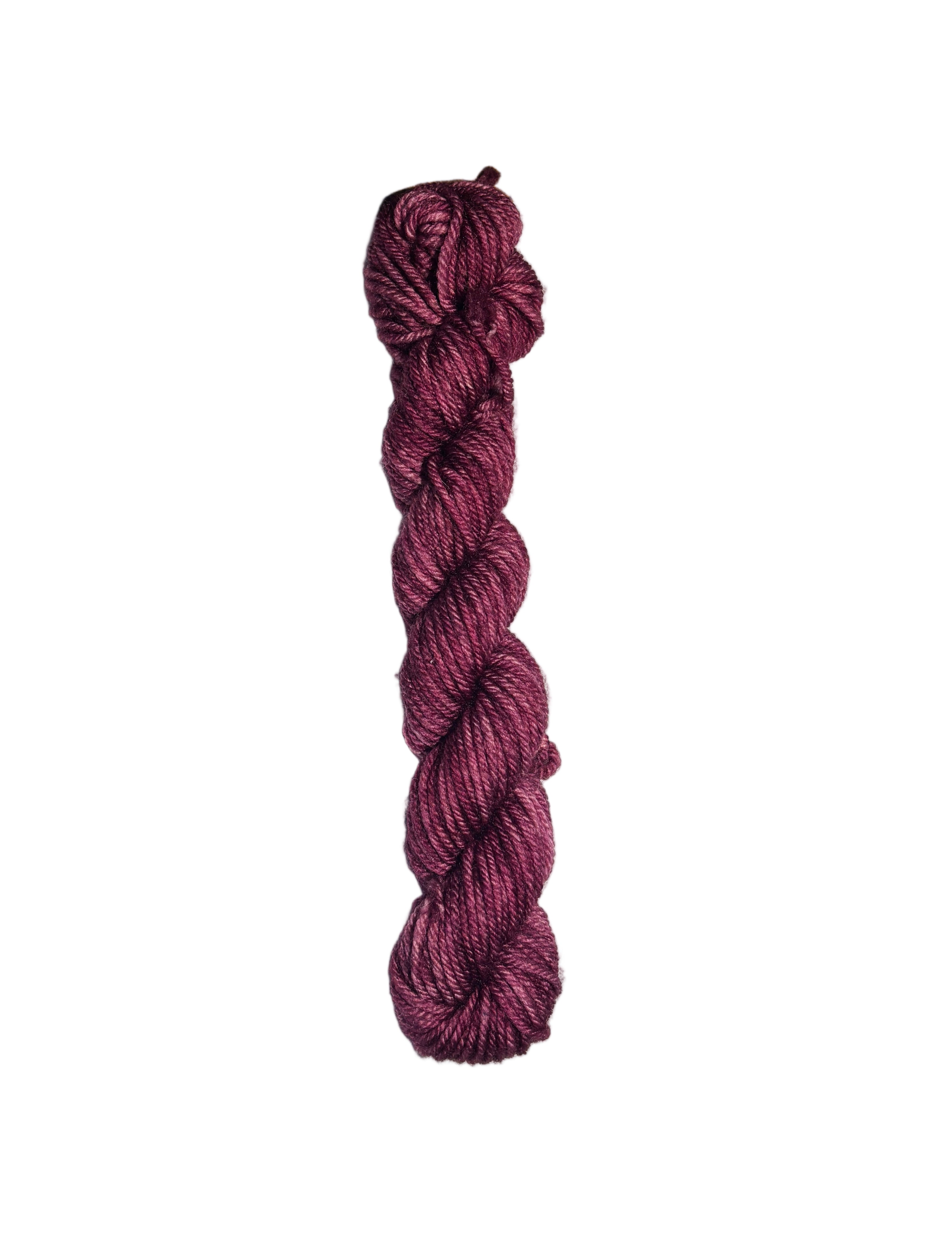 Burgundy skein of wool yarn on a white background