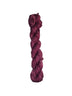 Burgundy skein of wool yarn on a white background