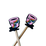 Stitch stoppers shaped like pink buckets with rainbows on them 