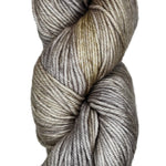 A skein of wool yarn in the color grey with khaki streaks
