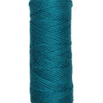 A photo of a skein of teal Coastal Cotton Cotton Yarn