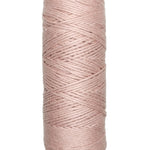 A photo of a skein of dusty pink Coastal Cotton Cotton Yarn