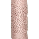 A photo of a skein of dusty pink Coastal Cotton Cotton Yarn