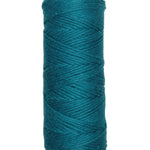 A photo of a skein of teal Coastal Cotton Cotton Yarn