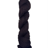 Dark Brown/Black skein of mountain meadow wool yarn on a white background