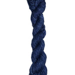 Dark blue skein of wool yarn on a white background