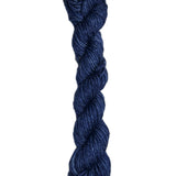 Dark blue skein of wool yarn on a white background