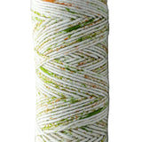 Green, orange speckled skein of yarn 