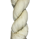 A skein of natural cream colored wool yarn 