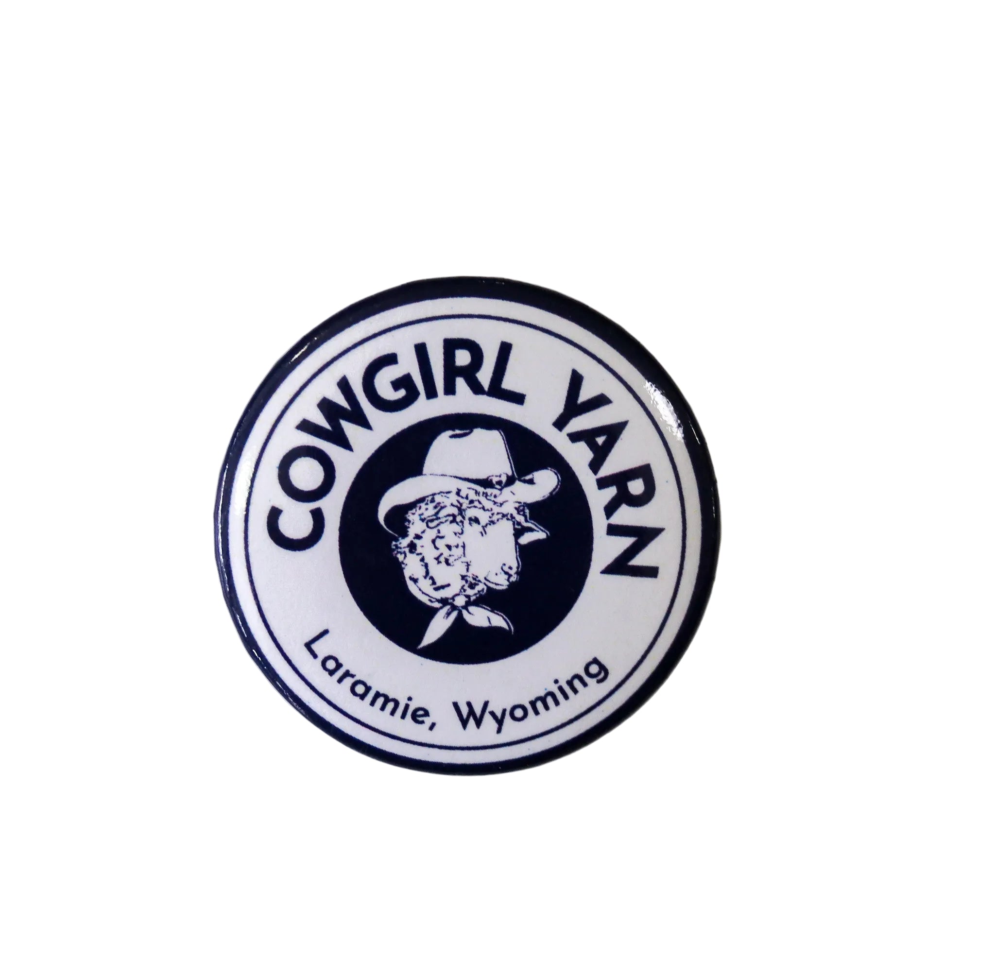 Small pin button with the cowgirl yarn logo on it