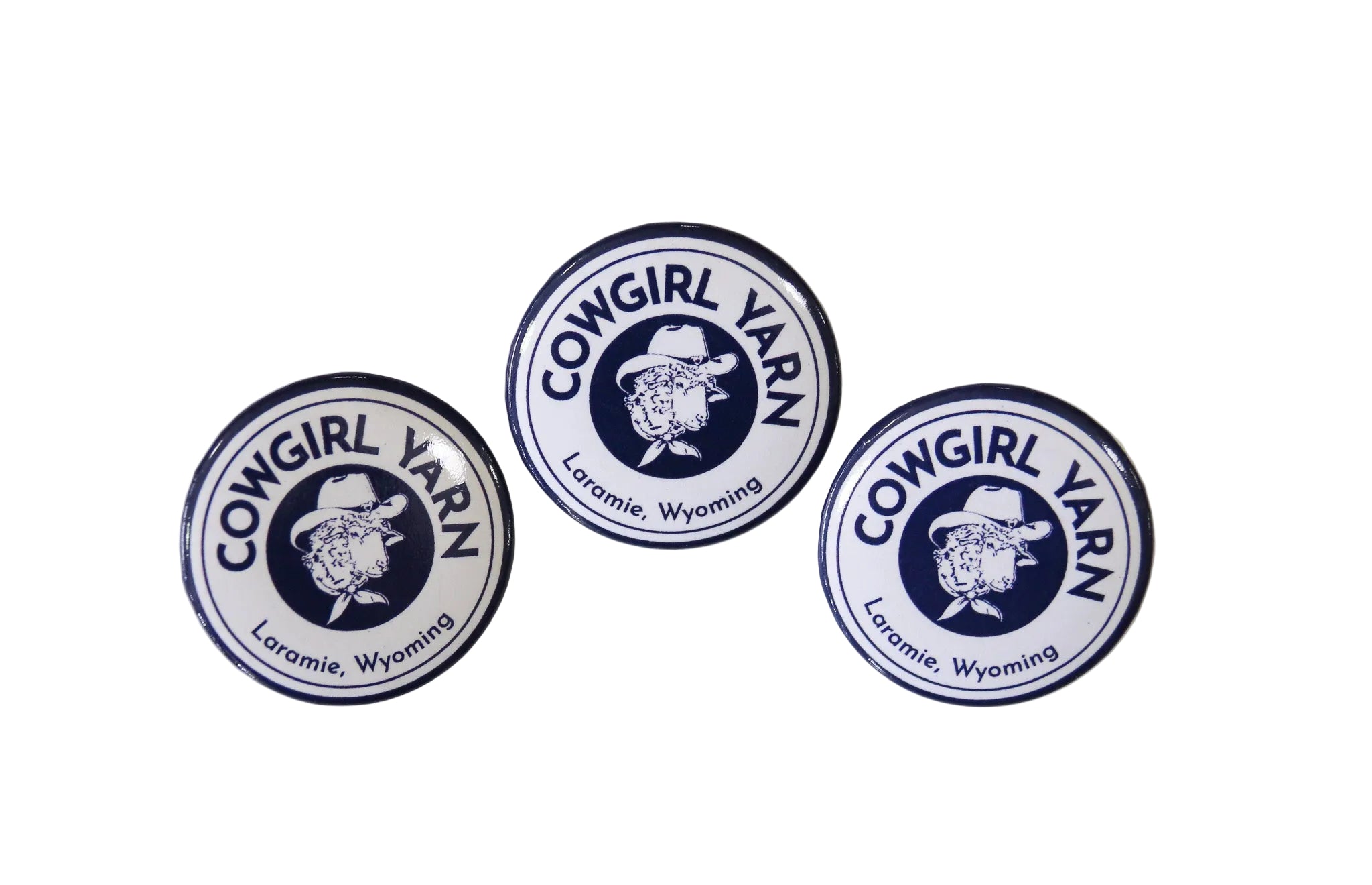 3 pin buttons with the Cowgirl Yarn logos on them