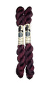 two mini skeins of yarn in a dark wine color