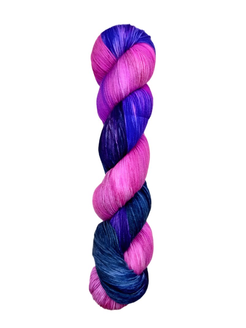 A skein of hand-dyed fingering/sock yarn color pink blue purple 