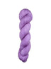 Purple skein of yarn on a light wooden surface