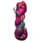 Multicolored skein of yarn on a white background