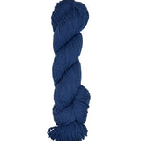 Teal skein of mountain meadow wool yarn on a white background