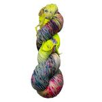 Multicolored skeins of yarn on a white background