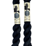 Mini skeins of hand dyed fingering weight yarn in the color black