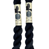 Mini skeins of hand dyed fingering weight yarn in the color black