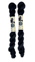Mini skeins of hand dyed fingering weight yarn in the color black
