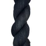 Skein of hand dyed fingering weight yarn in the color black