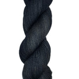 Skein of hand dyed fingering weight yarn in the color black