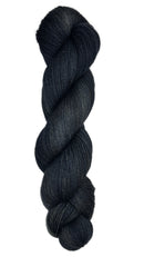 Skein of hand dyed fingering weight yarn in the color black