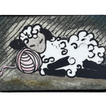 Small rectangular tin with a cartoon design of a sleepy sheep on a white background