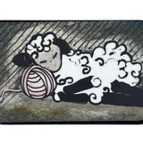 Small rectangular tin with a cartoon design of a sleepy sheep on a white background