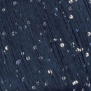 Close-up of a dark navy, almost black, Paillettes yarn
