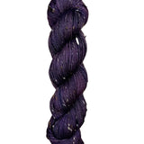 Skein of hand dyed BFL Tweed Yarn color deep purple