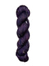 Skein of hand dyed BFL Tweed Yarn color deep purple