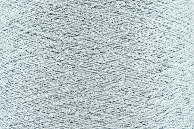 Close-up of Silver White, a white base yarn with silver sparkles