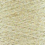 Close-up of Gold White, a white base yarn with gold sparkles