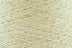 Close-up of Gold White, a white base yarn with gold sparkles