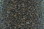Close-up of Silver-Gold Black, a black base yarn with silver and gold sparkles