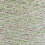 Close-up of Green-Pink White, a white base yarn with light green and pink sparkles