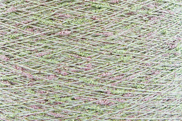 Close-up of Green-Pink White, a white base yarn with light green and pink sparkles
