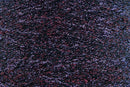 Close-up of Lilac-Red Black, a black base yarn with red and purple sparkles
